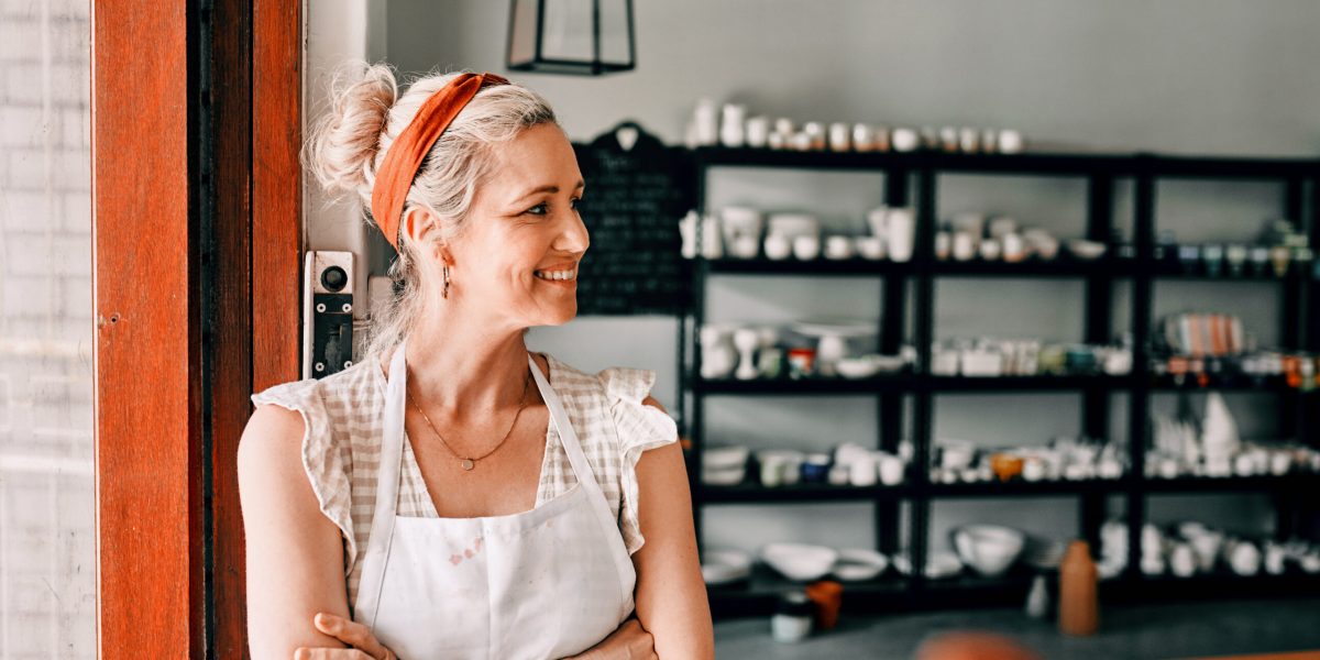 Cropped shot of an attractive mature woman standing with her arms folded in her pottery workshop.