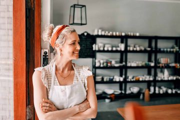 Cropped shot of an attractive mature woman standing with her arms folded in her pottery workshop.