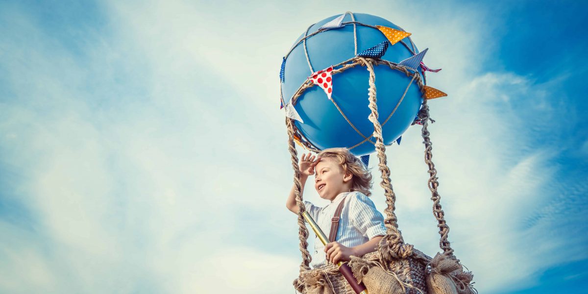 Little boy in a balloon outdoors