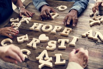 A wooden alphabet hope word on the table