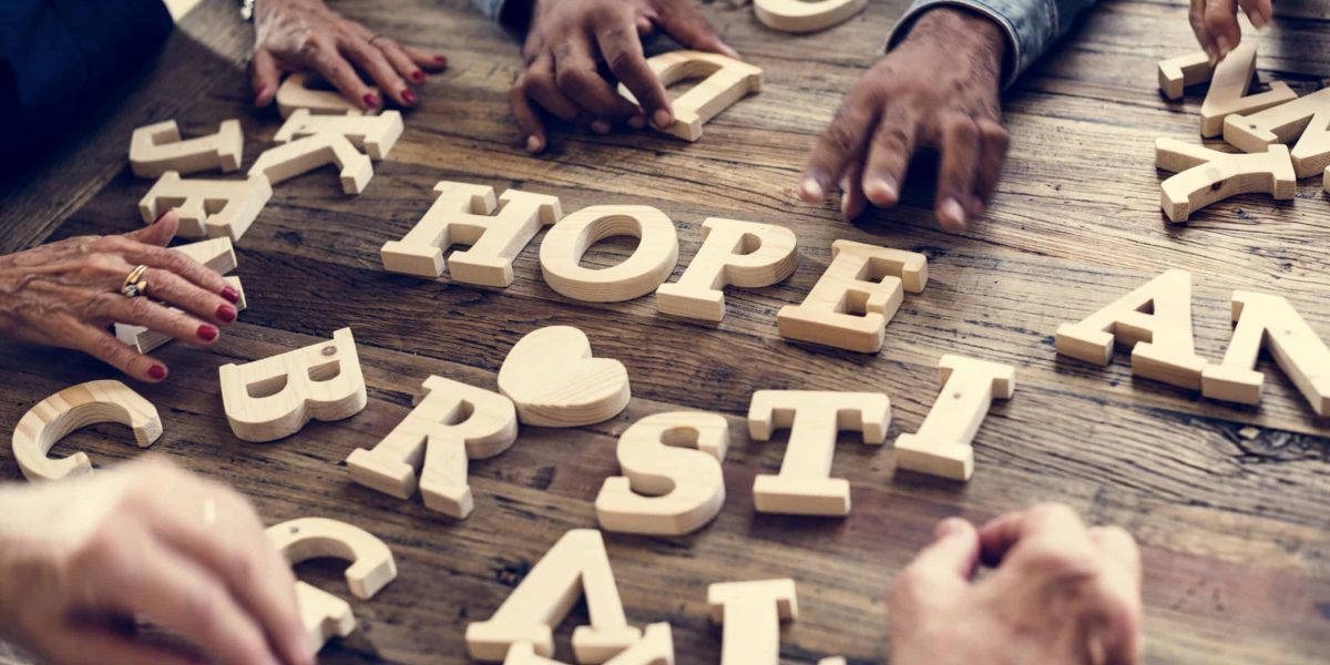 A wooden alphabet hope word on the table