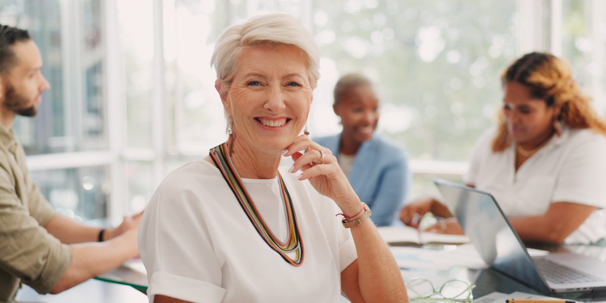Meeting, smile and face of a business woman, leader or ceo in the office conference room with emplo.